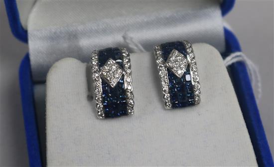 A modern pair of 18ct white gold, sapphire and diamond curved rectangular ear clips, 17mm.